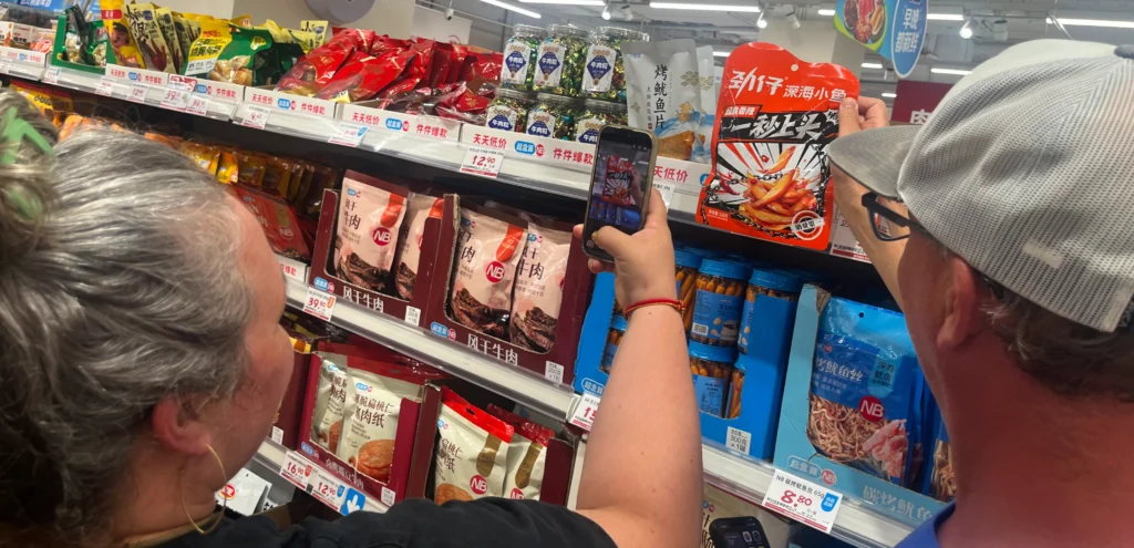 Krissy & Bryan taking a picture of Chinese Packaging Design